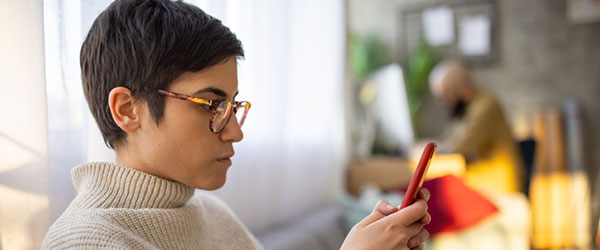 woman looking at her phone